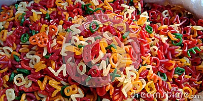 Alphabet shape chips pattern isolated in multicolored Stock Photo