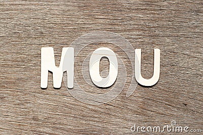 Alphabet in word MOU Abbreviation of memorandum of understanding on wood background Stock Photo
