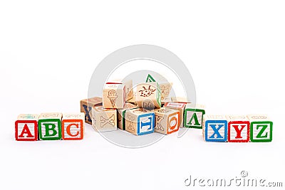 Alphabets cubes scattered on white background with a selective focused on ABC and XYZ alphabets Stock Photo