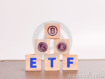 Alphabets ETF on wooden cubes with crypto currency symbol. Editorial Stock Photo