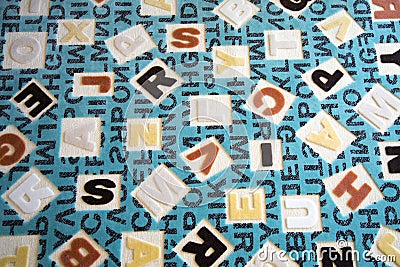 Alphabets on a Fabric Carpet Surface Stock Photo