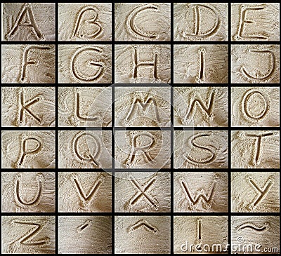 Alphabets in the sand Stock Photo