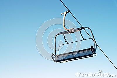 Alpine chair lift blue sky mountain ski winter fun snowboarding Stock Photo