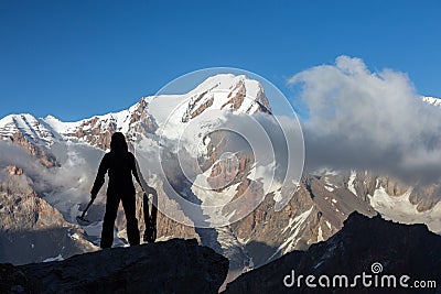 Alpine Climber Arranging Descent with Rope and Ice Axe Stock Photo