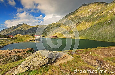 Alpine lake and restaurant on a lake,Balea lake,Fagaras mountains,Carpathians,Romania Stock Photo