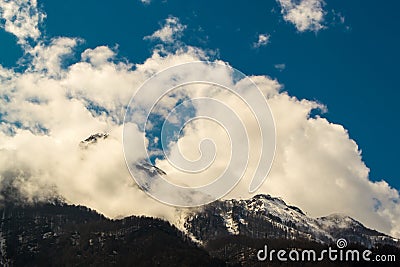 Alpine Mountains and Clouds Stock Photo