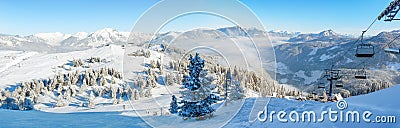 Alpine ski slope mountain winter panorama with ski lift Stock Photo