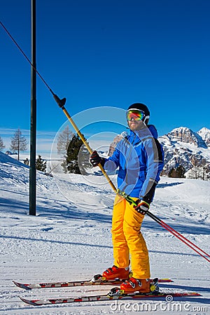 Alpine skier with T-bar lift Stock Photo