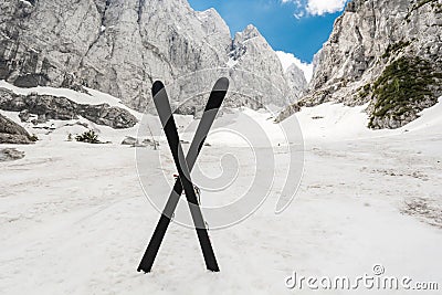 Alpine valley with a pair of crossed skis Stock Photo