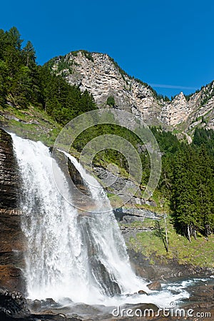 Alpine waterfall in mountain forest Stock Photo