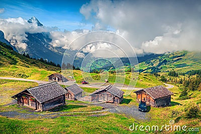 Alpine wooden farmhouses and mountain farmland, Grindelwald, Bernese Oberland, Switzerland Stock Photo