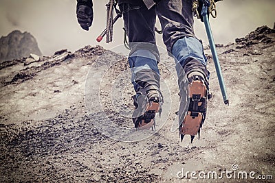 Alpinist climbing on glacier Stock Photo