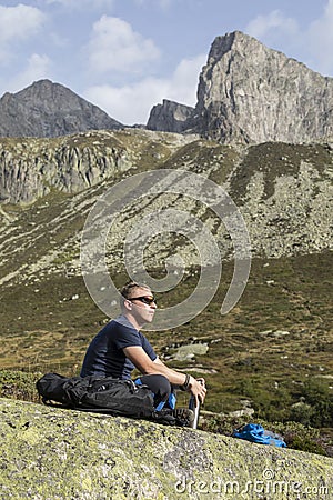 Alpinist meditates according to the meaning of life Stock Photo