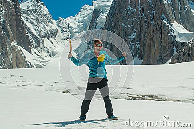 Alpinist on the glacier at high altitude snow mountains Editorial Stock Photo