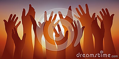 Symbol of the union with several hands raised in front of a setting sun. Stock Photo