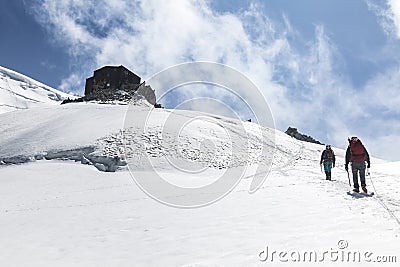 Alpinists ascend to the Cosmique refuge past Col du Midi in the French Alps, Chamonix Mont-Blanc, France Stock Photo