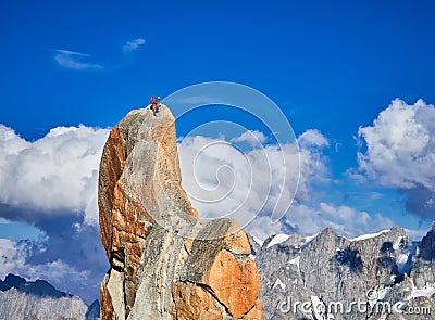 Alpinists climbing on rocks at Aiguille du Midi, Chamonix, France Stock Photo