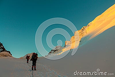 Alpinists on the glacier at high altitude snow mountains Editorial Stock Photo