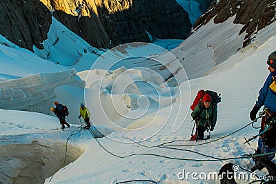 Alpinists on the glacier at high altitude snow mountains Editorial Stock Photo