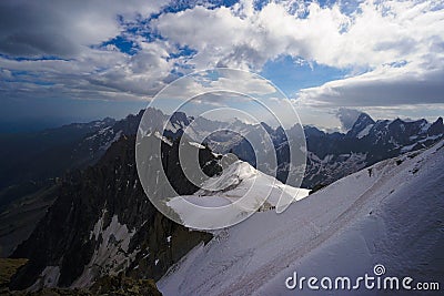 Alpinists on sheer mountain range Stock Photo