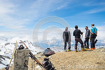 Alpinists on top at high altitude in the Alps Editorial Stock Photo