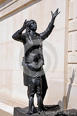 Staues of a mother and her child in the inner circle of the Armed Forces Memorial , Alrewas. Editorial Stock Photo