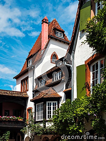 Alsace`s sun-drenched gingerbread houses. Tiled roofs, flowers all around, the summer sun is shining. Beauty Stock Photo