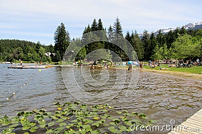 People are enjoying boating and swimming in Alta lake, Whistler, BC, Canada Editorial Stock Photo