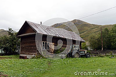 Old tractor T-40 in the village yard of the village Chineta Altai Krai Stock Photo