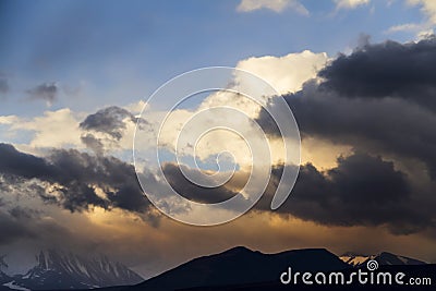 Altai Ukok the sunset over the mountains in cloudy cold weather. Stock Photo
