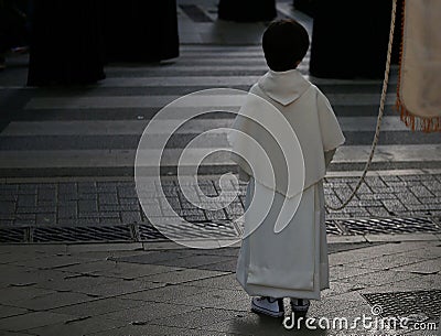 Altar boy seen during an easter holy week procession in mallorca Editorial Stock Photo