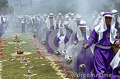 Altar boys swinging censers in Holy Week procession Editorial Stock Photo