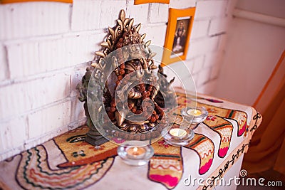 The altar of Ganesha with candles Stock Photo