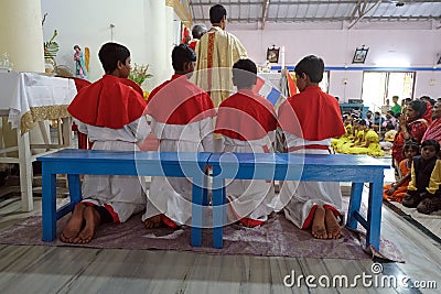 Altar servers at Mass at Our Lady of Lourdes Church in Kumrokhali, India Editorial Stock Photo