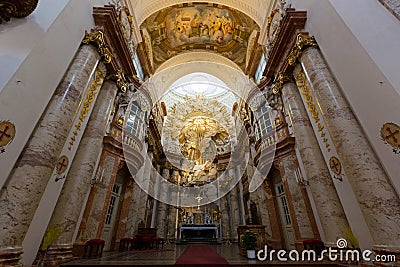 Altar at St. Charles Church, Karlsplatz in Vienna, Austria. Golden piece above altar symbolizing Yahweh, national god of Israel Editorial Stock Photo