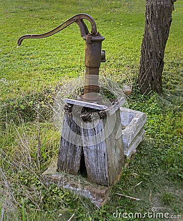 Old rusty hand pump Stock Photo