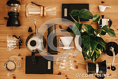 Alternative coffee brewing method set, flat lay. Stylish accessories and items for alternative coffee on wooden table. Kettle, Stock Photo