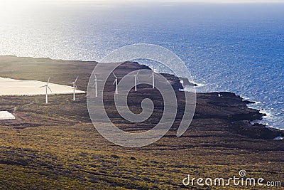 Wind power plant on the ocean shore. Stock Photo