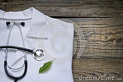 Alternative medicine stethoscope and green symbol background Stock Photo