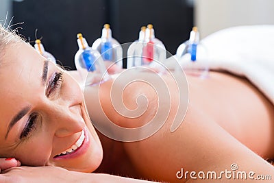 Alternative practitioner cupping woman Stock Photo