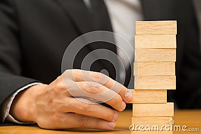 Alternative risk concept. Businessman choosing the wood block Stock Photo