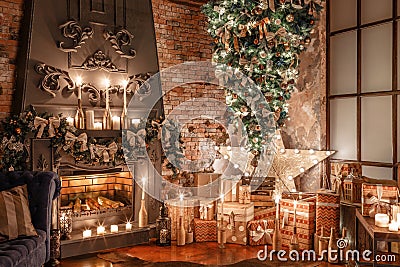 Alternative tree upside down on the ceiling. Winter home decor. Christmas in loft interior against brick wall. Stock Photo