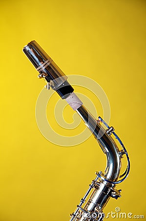 Alto Saxophone Neck Isolated on Yellow Stock Photo