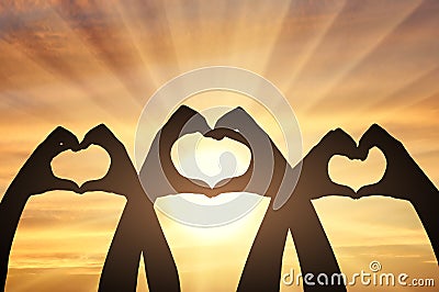 Altruism. Three pairs of hands show a heart symbol Stock Photo