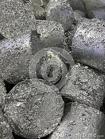 Aluminium turnings compressed into briquettes for recycling Stock Photo