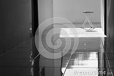 Aluminum chairs in black and white with harsh shadows. Loneliness and the concept of alienation Stock Photo