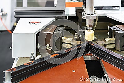 Aluminum door or windows frame corner crimping of assembly machine for production manufacturing process in factory Stock Photo