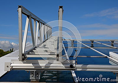 aluminum footbridge for washing windows above the skylight. Stock Photo