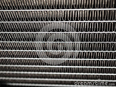 Aluminum radiator on the grille with a thin plate and for cooling parts, water cooling system, heat dissipation, selective Stock Photo