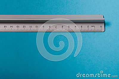 aluminum ruler on blue background Stock Photo
